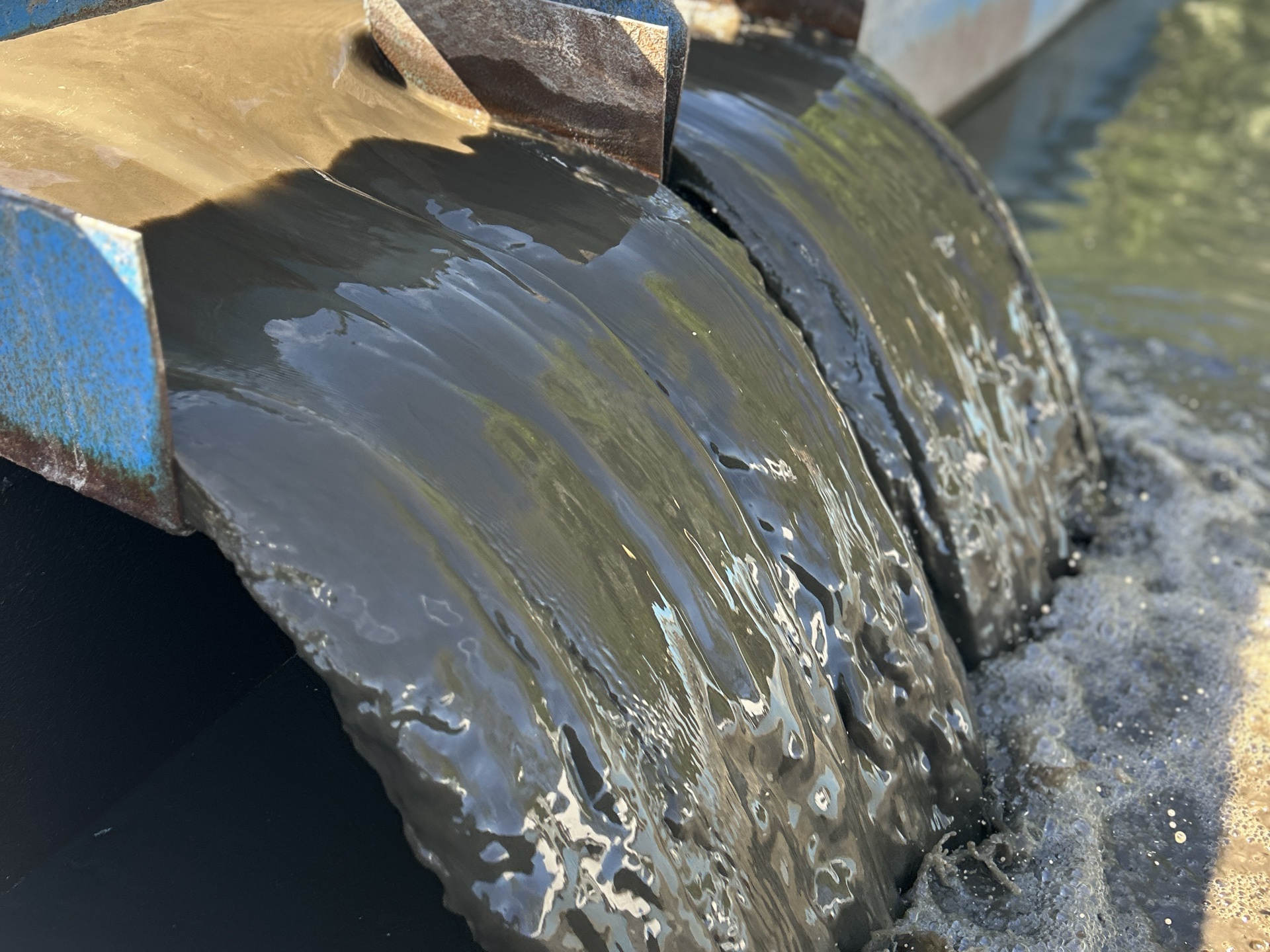 Muck being processed through restoration equipment